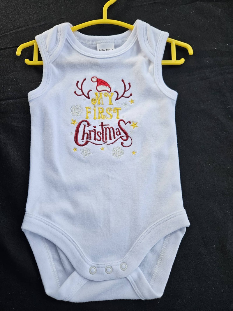 1st Christmas Onesie $20 Sizes 000-2 Short Sleeves or singlet.  White, Black, Tan, Blue or Pink